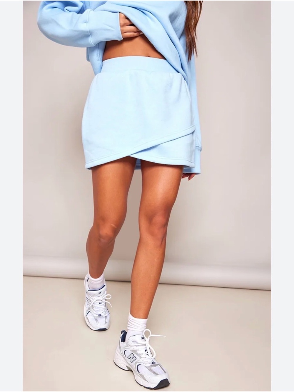 NWT PrettyLittleThing Jersey Knit Mini Skirt Faux Wrap Hem Light Blue Size L